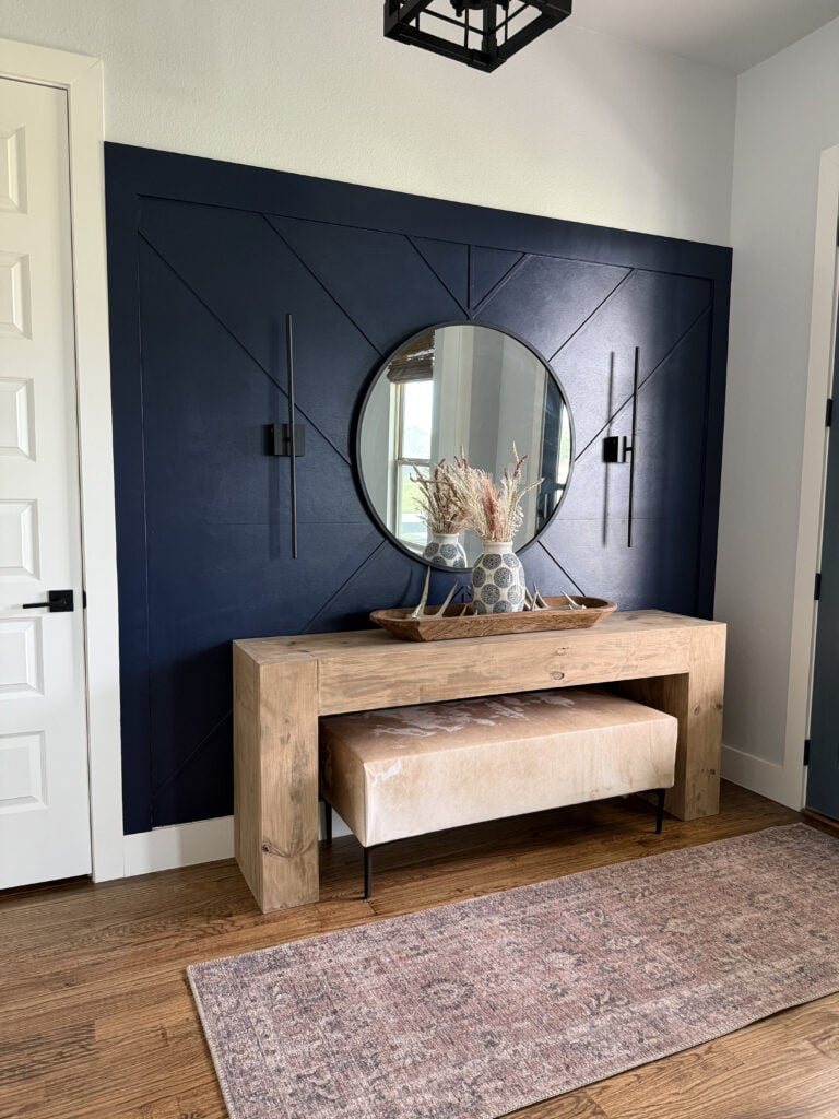 DIY cowhide bench styled under of a console table.