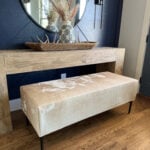 Modern rustic cowhide upholstered bench built with 2x4s and free plans.