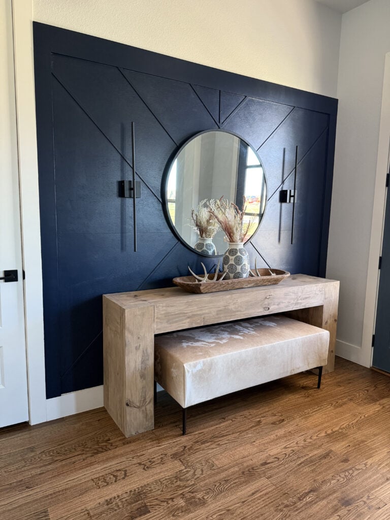 Modern farmhouse entryway styled with a DIY cowhide bench.