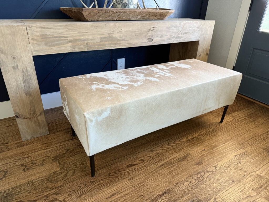 Close-up of the cowhide upholstery on the DIY bench seat.